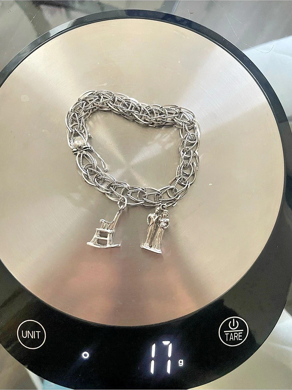 Vintage Sterling Silver charm bracelet with two charms